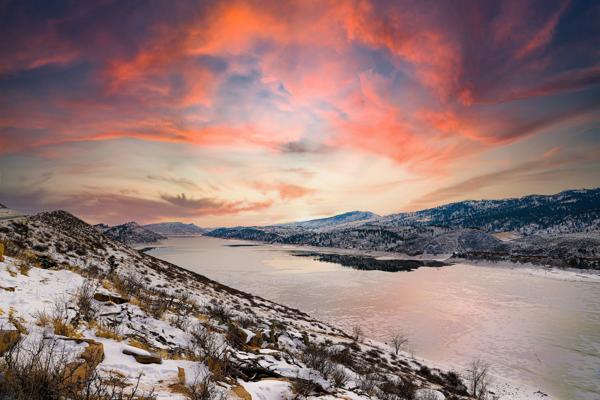 Sunset over a snow-dusted Horsetooth Reservoir above Fort Collins, Colorado