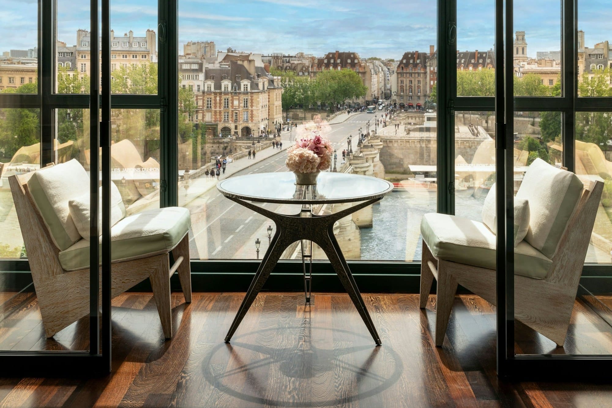 A winter garden at Cheval Blanc Paris looking over the Pont Neuf
