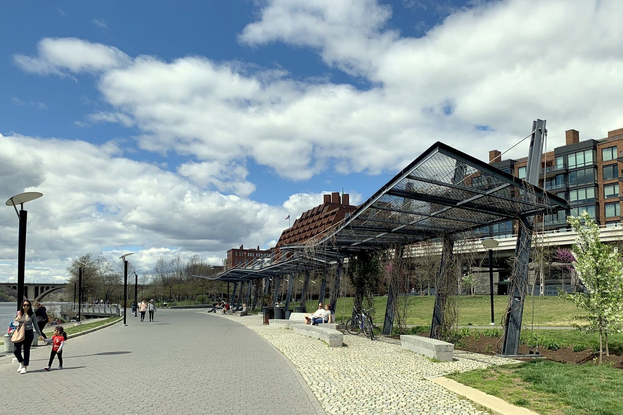 The riverside promenade and lawns of Georgetown Waterfront Park, Washington, on a spring day