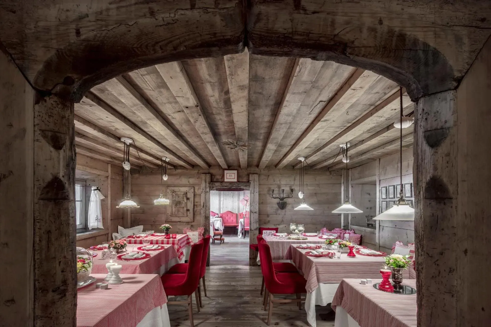 A timbered dining room at Hotel La Perla, Corvara
