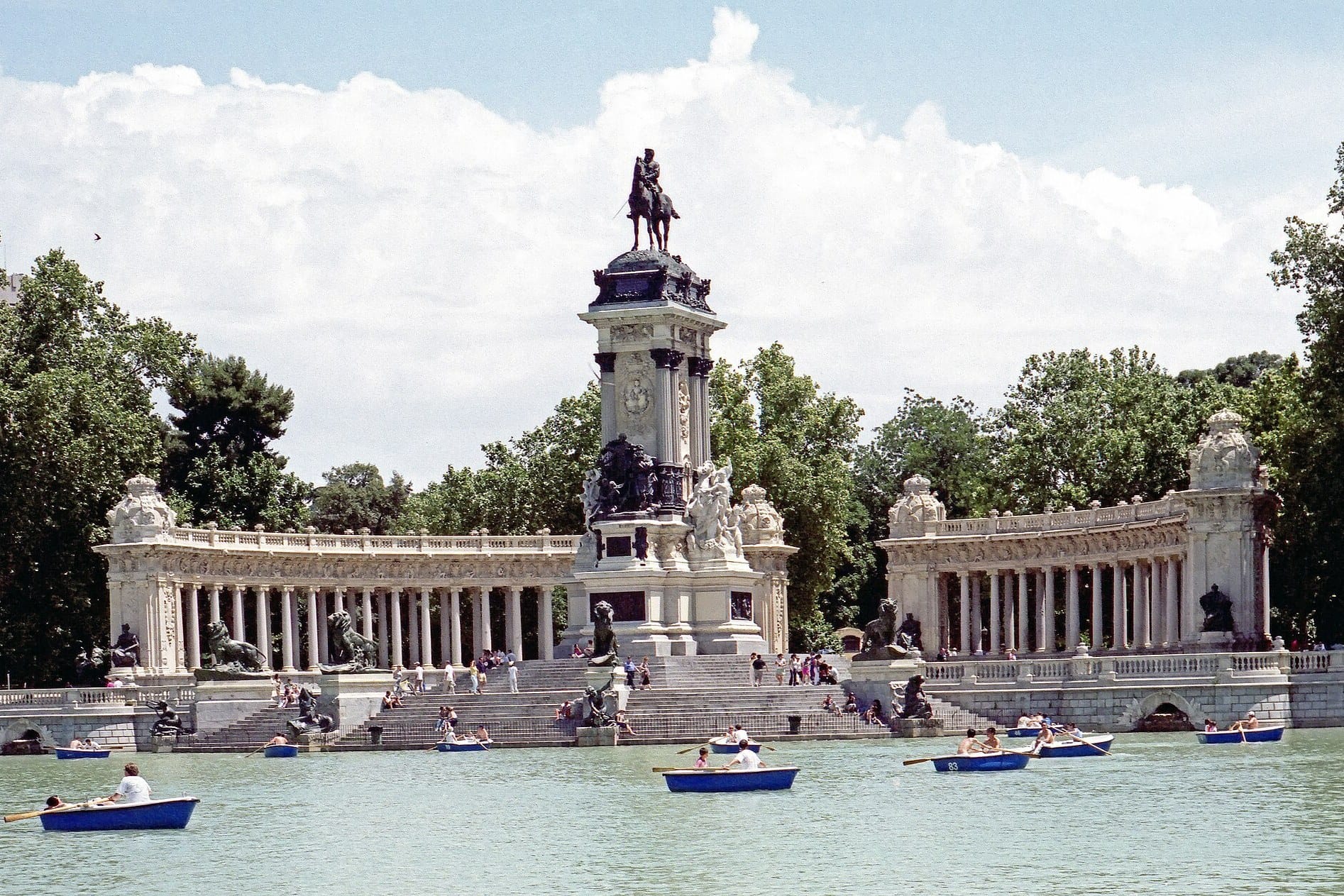 Rowing boats on the Retiro lake below the monument to Alfonso XII