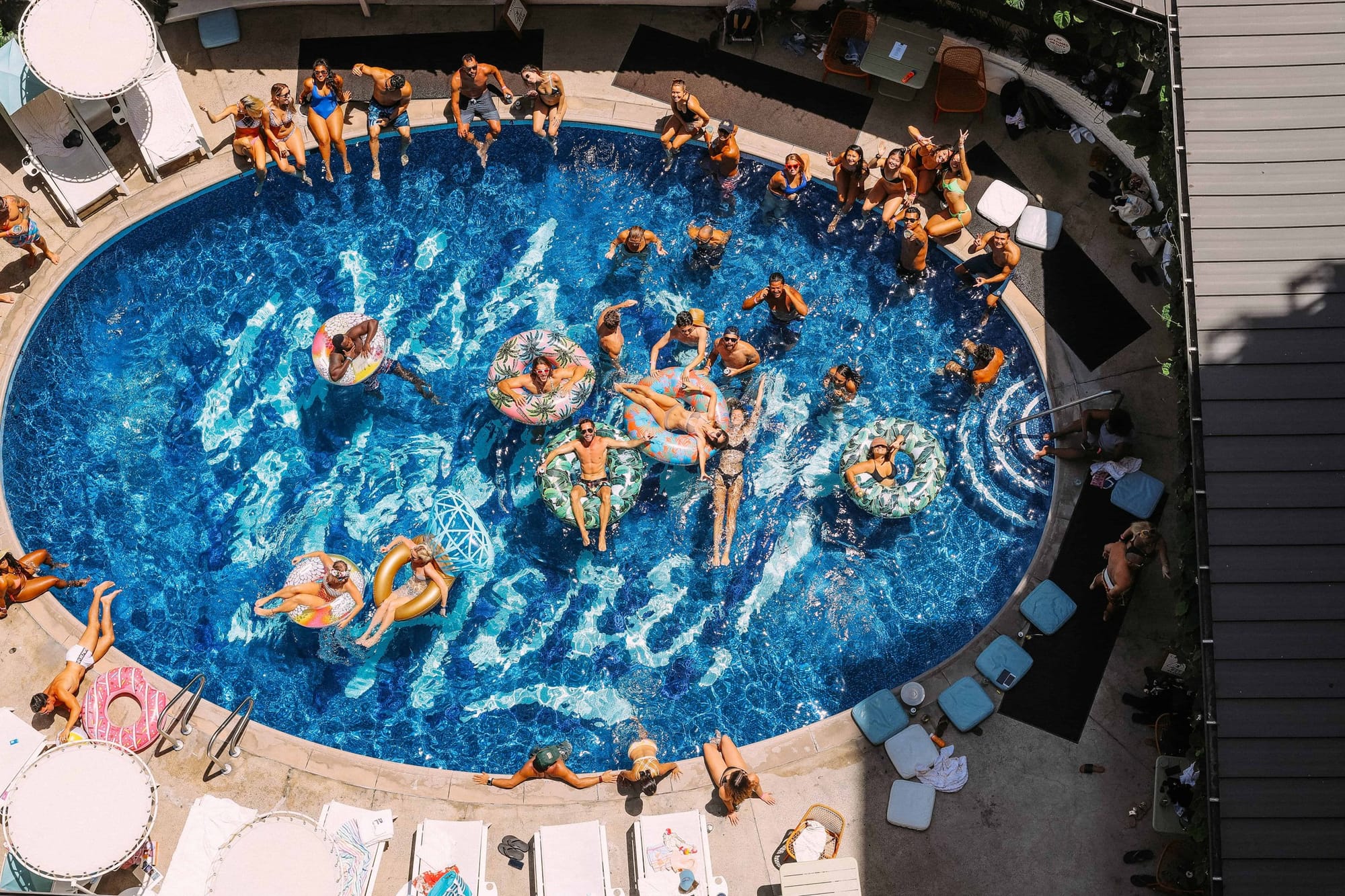 A pool party at the Surfjack Hotel & Swim Club seen from above