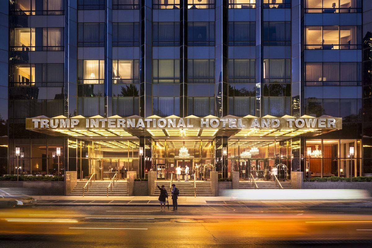 The entrance of Trump International Hotel & Tower New York at dusk