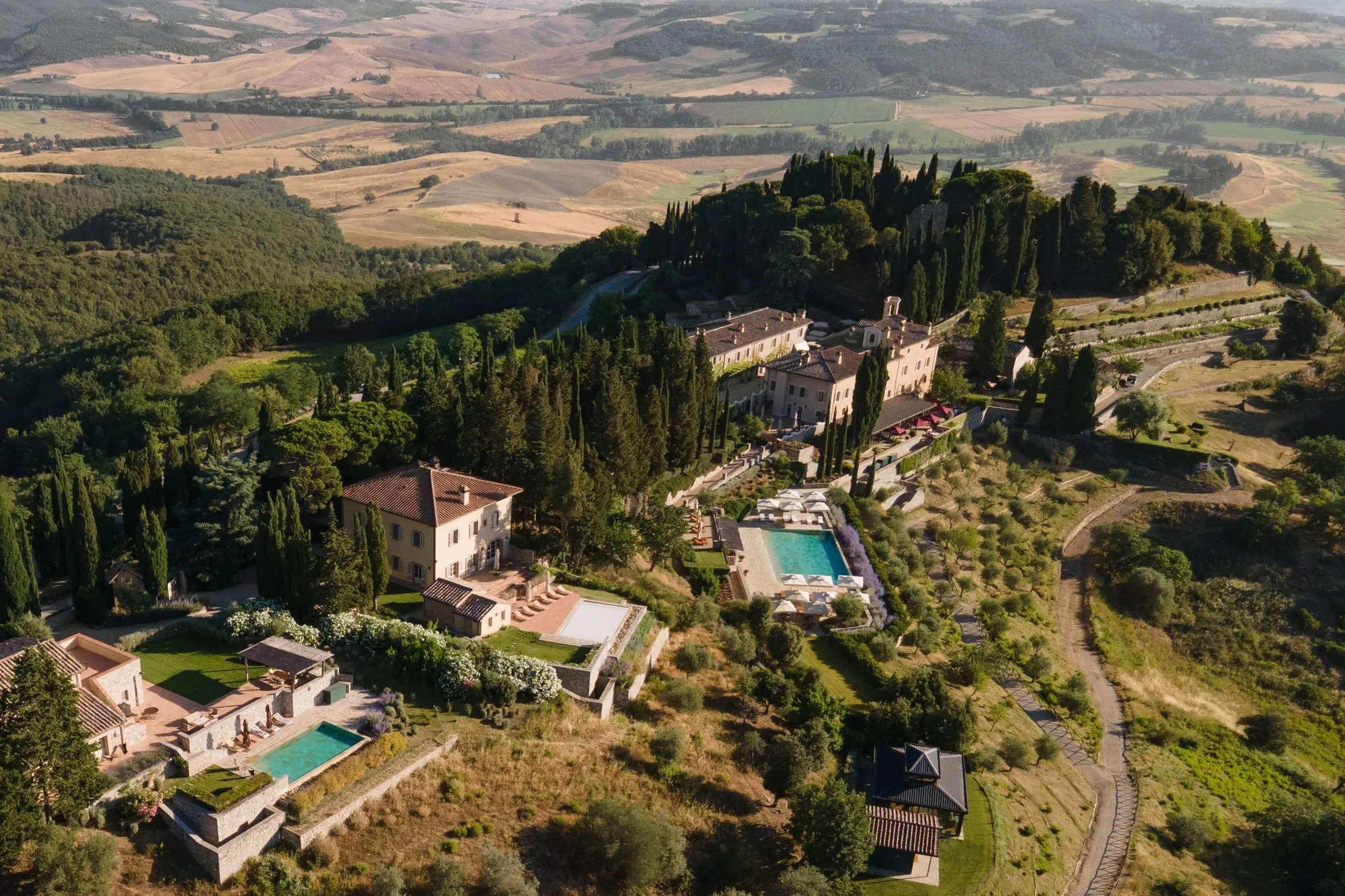 The medieval borgo of Castiglion del Bosco among cypresses above the Val d'Orcia