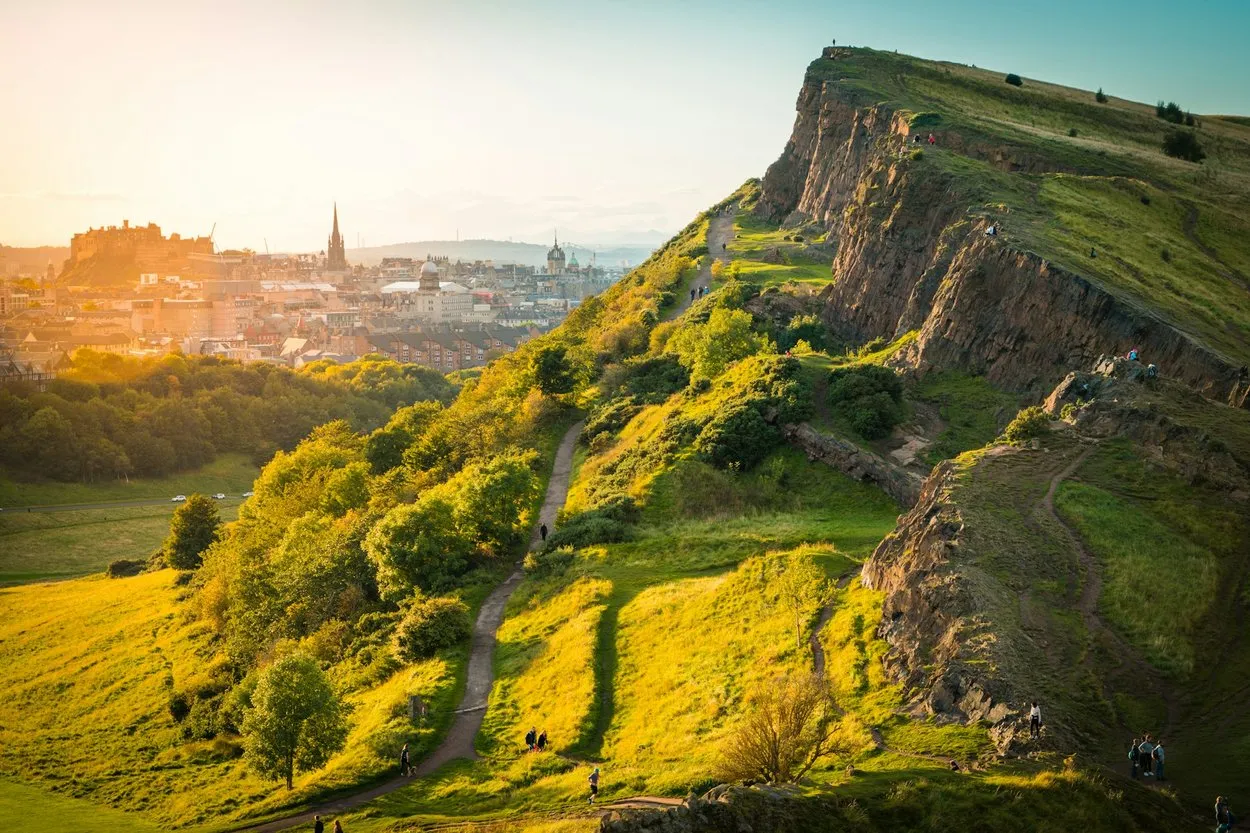 The path below Salisbury Crags in Holyrood Park, with Edinburgh Castle and the Old Town beyond