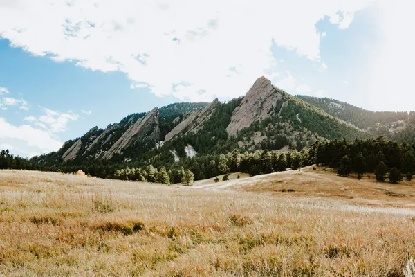 The Flatirons rising above the grasslands west of Boulder, Colorado