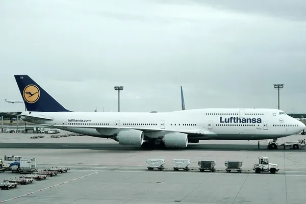 A Lufthansa Boeing 747 on the apron at an airport