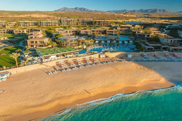 Aerial view of Montage Los Cabos above the beach on Santa Maria Bay with the Baja mountains behind