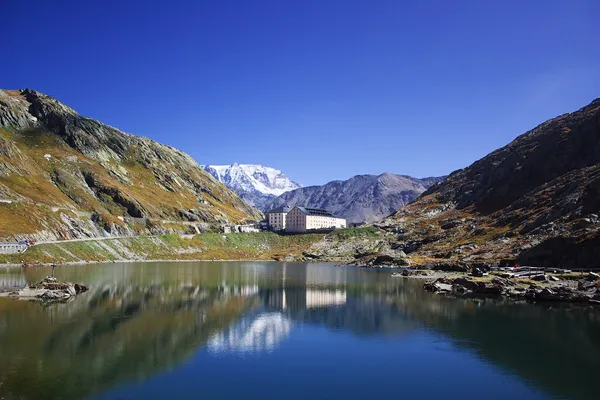 The Great St Bernard Hospice beside the lake at the top of the pass